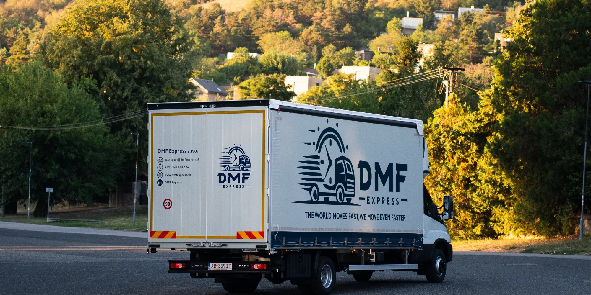 Curtain-side body of a DMF Express vehicle opened for side loading of palletised part loads